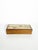 Decorative rectangular wooden box featuring an elegant marquetry decoration on the lid. The composition depicts stylized...