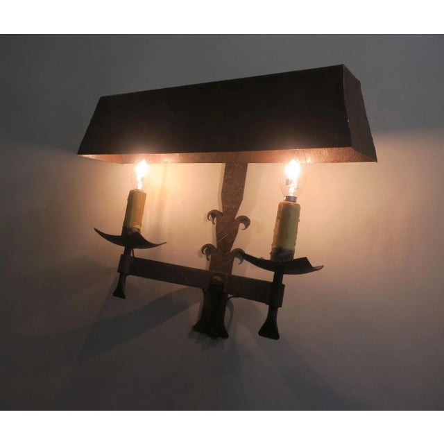 Striking pair of Brutalist mid century wall lights, patinated wrought iron, in good working order, new wiring. Up to 250V...