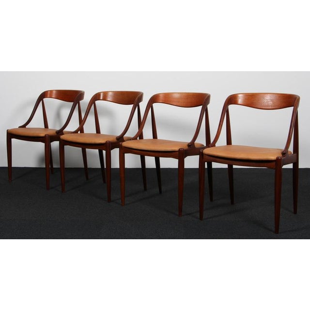 Johannes Andersen four dining chairs in solid oiled teak. New upholstered with vintage tan aniline leather. Model 16, made...