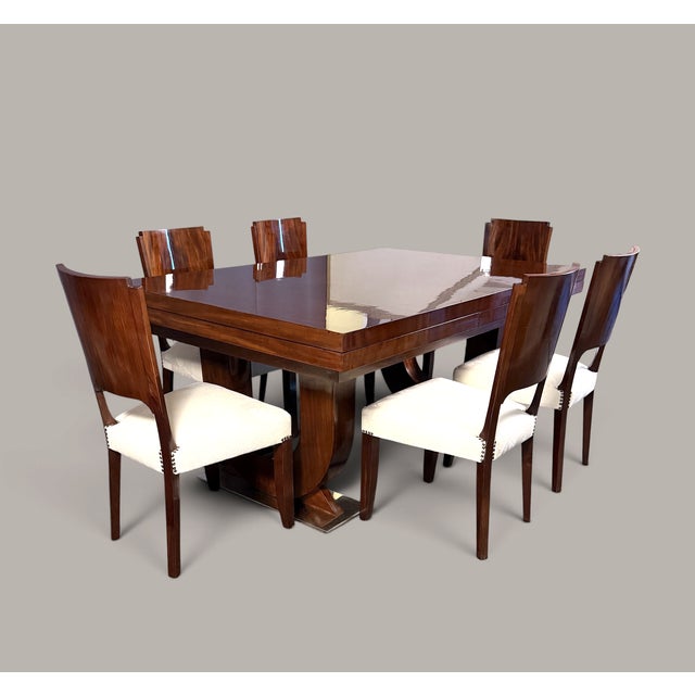 This French Art Deco dining room set combines the warm radiance of mahogany with a striking, clearly defined form. The...
