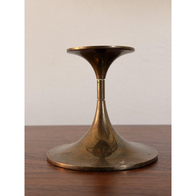 Elegant, solid brass candlestick in a flowing trumpet shape from the 1960s. design and manufacture: max brüel torben...