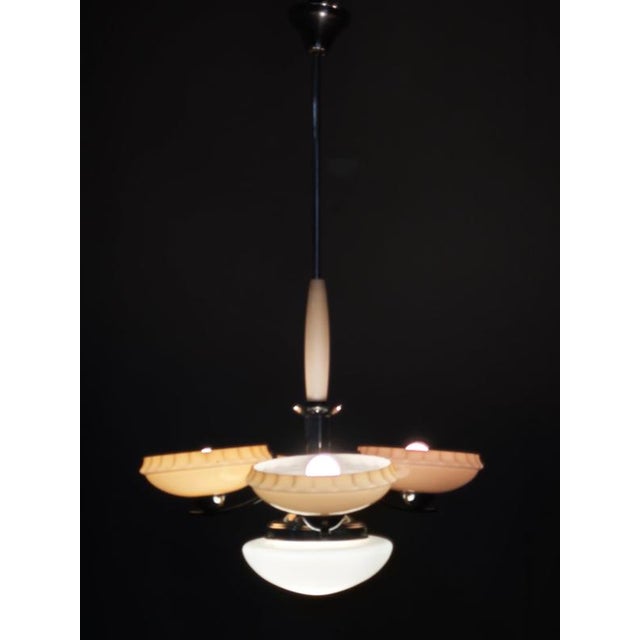 Elegant original art deco chandelier produced in czechoslovakia during the 1930s, featuring a sophisticated combination of...