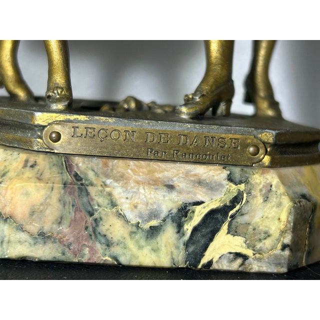 "A stunning, authentic late 19th-century matching pair of French Victorian figural spelter statues titled 'Premieres...