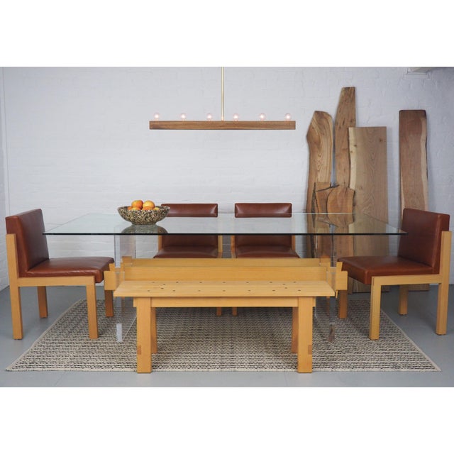 2-person dining bench with hand-forged iron nail trim in solid pine with hand-wiped oil finish. Can be used indoors or...