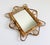 This shape! A fun vintage mid-century modern Italian wall mirror crafted from bamboo and rattan, dating back to the...
