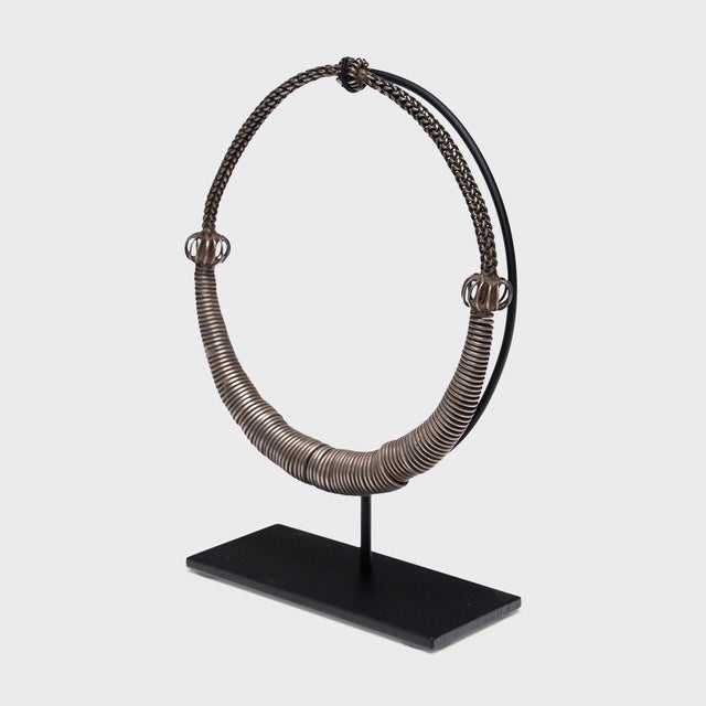 This intricate silver necklace was once a part of the elaborate attire of a Miao women in southwest China, an ethnic...