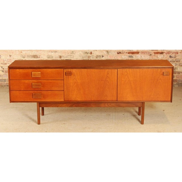 Teak midcentury sideboard by white & newton c.1960s a midcentury teak sideboard by white & newton, made in england circa...