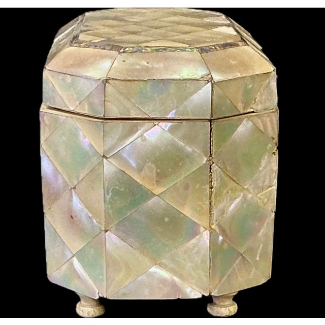 Beautifully crafted Mother-Of-Pearl English Tea Caddy. The caddy is clad throughout in hand-cut, iridescent mother-of-...