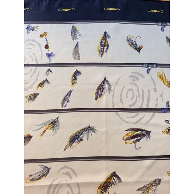 Hermès "Flies" silk scarf (1988) This rare scarf celebrates the world of fly fishing. It features various fly-fishing...