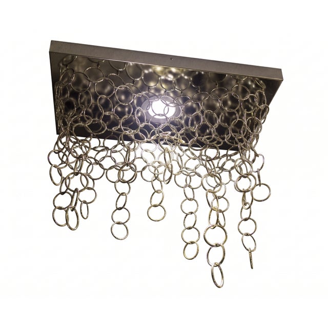 The concept: the continuous flow of infinity infinite is a conceptual lighting piece where light is captured and reshaped...