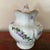 Maddocks Lamberton Works Floral Patterned Pitcher / Vase Features: floral patterns in lavender and green on exterior of...