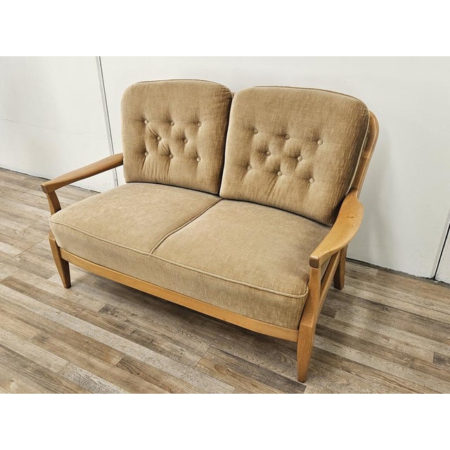 Vintage 70s sofa in beech wood and padded cushions in matching fabric. Very elegant and linear, with a modern design and...