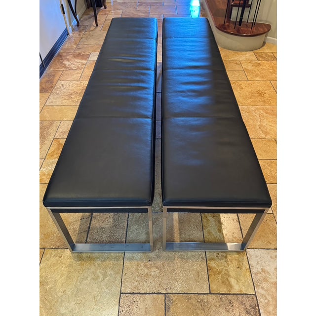 Introduce architectural rigor and sleek geometric symmetry to your space with this exceptional, structurally striking pair...