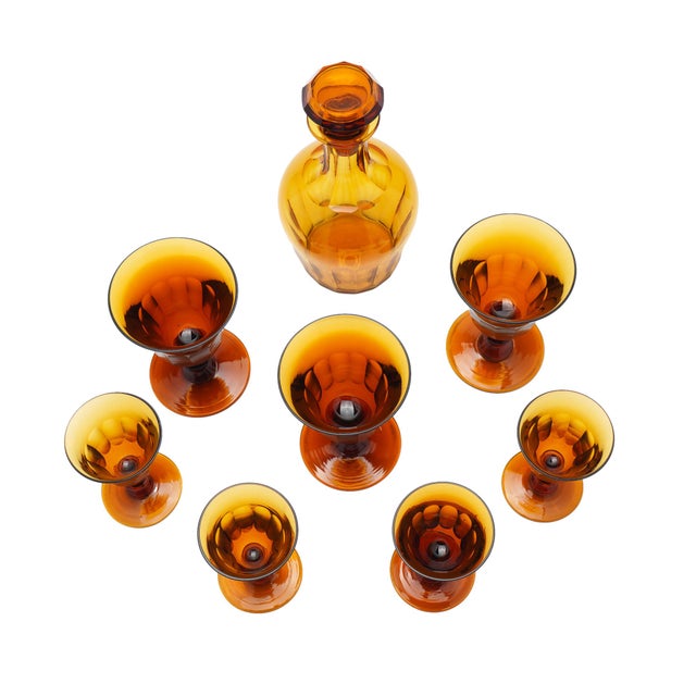 An 1830s amber cut glass decanter and stemware set attributed to Phineas Dummer of the Jersey Glass Company, Jersey City,...
