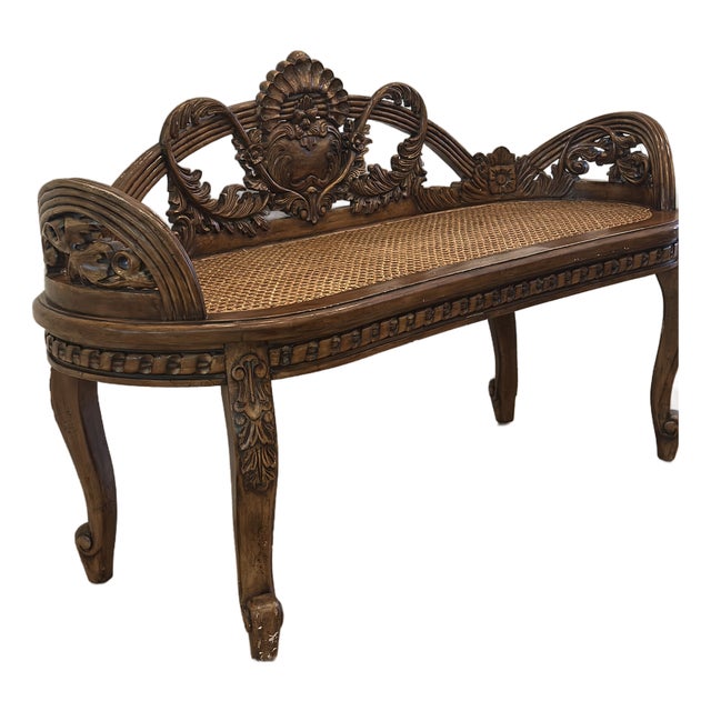 Vintage Hand-Carved Cane Bench With Ornate Floral Crest For Sale