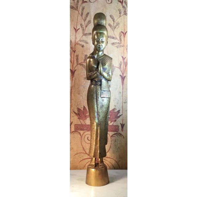 Elegant statue made of bronze, beautiful facial expression, hands pointed forward in grace and goodwill. Exceptional dress...