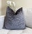 This graphite pillow features dark gray textured velvet with a subtle leopard pattern, adding depth and dimension. Its...