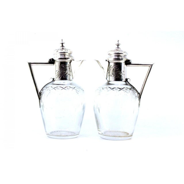 Wine Jugs in Cut Glass, Set of 2, in Very Good conditions. Designed 1890 to 1919 This piece has an attribution mark, I am...