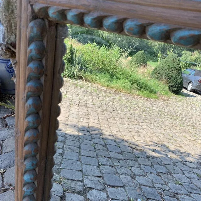 Large mirror with a patinated blue rosary with a raw and authentic look that we love. Two points of attachment the top,...