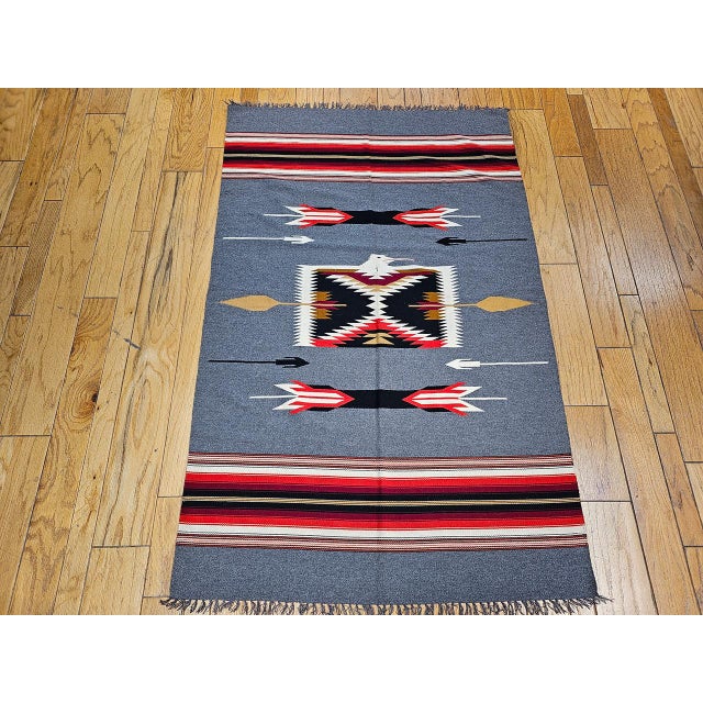 This vintage American Southwestern kilim, handwoven in the late 1900s, features a finely detailed design and a soft...