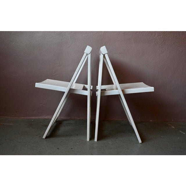 Here's a beautiful pair of folding chairs that evoke the best of 1960s Italian design! Lightweight, elegant, and...