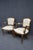 Pair of carved wood armchairs by Chateau d’Ax, made in Italy. Shaped frames with carved crest rails, scrolled arms, and...