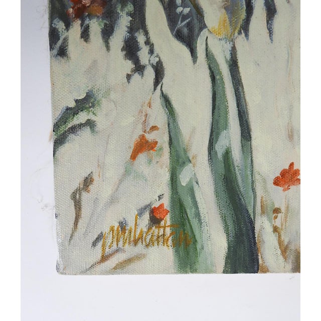 Late 20th century oil on canvas painting of orange tabby cat wearing a bell collar in a garden with purple iris by...