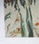 Late 20th century oil on canvas painting of orange tabby cat wearing a bell collar in a garden with purple iris by...