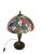 Tiffany Style Stained Glass Table Lamp characterized by its vibrant floral motifs and classic Art Nouveau aesthetic. The...