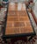 Crafted with high-quality hardwood, this table showcases a stunning burl wood top and sleek Ming inspired black lacquer...