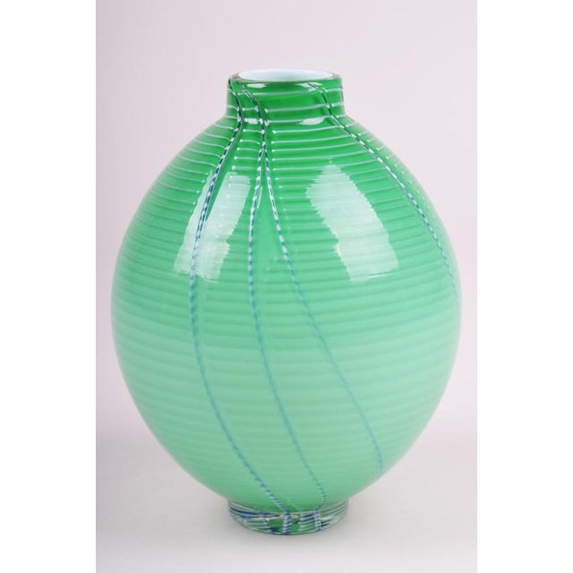 This extraordinary glass vase represents a prime example of Czechoslovak studio glass from the 1960s. It is a fascinating...