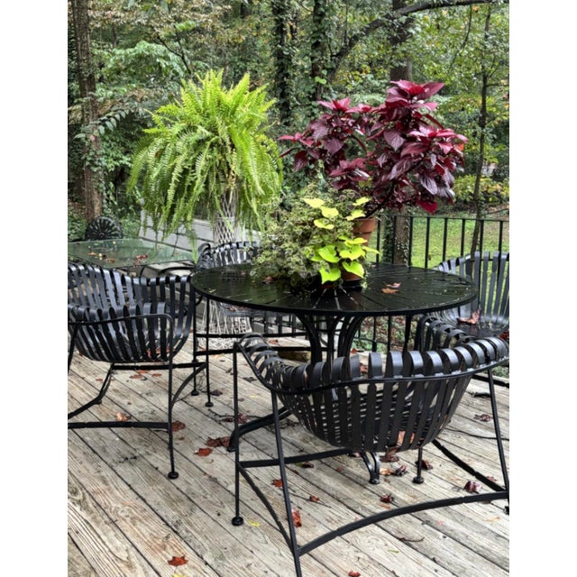 Gorgeous MCM time-capsule painted wrought iron, garden patio dining set with round, sunburst table and four strap iron...
