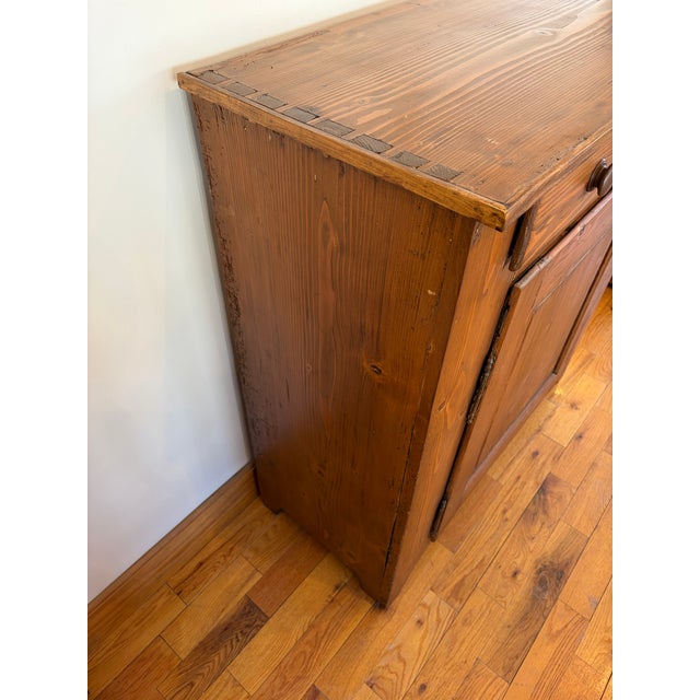 This Primitive and Country Style Jelly cupboard is a older restored antique piece that the gallery here in Sunapee...