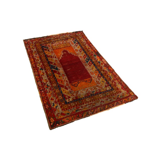 Hand knotted in wool originating from Persia between 1950-1960, this vintage mid-century Kirsehir rug enjoys one of the...