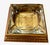 A striking vintage pressed-glass ashtray set into a stepped gilt-finished wooden base, combining sculptural glass with...