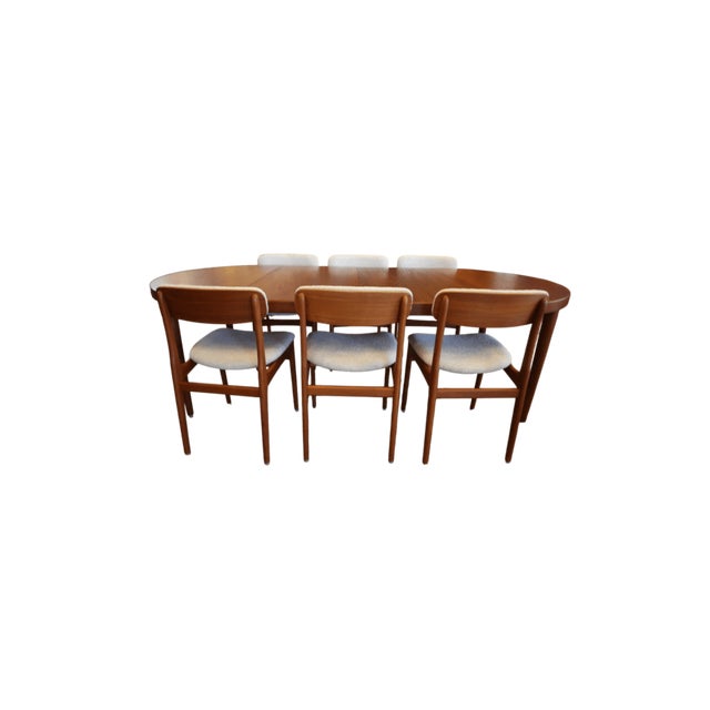 What a gem we have here—a stunning Danish teak dining table from the 1960s that truly appeals to the discerning interior...