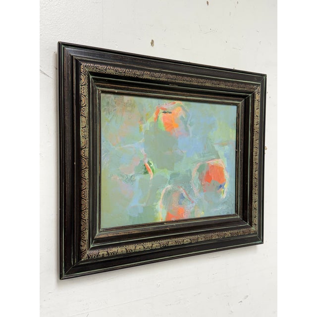 Design Plus Gallery presents an Oil Painting of Flowers that is Framed in Black Wood with Carved Details. The dark frame...