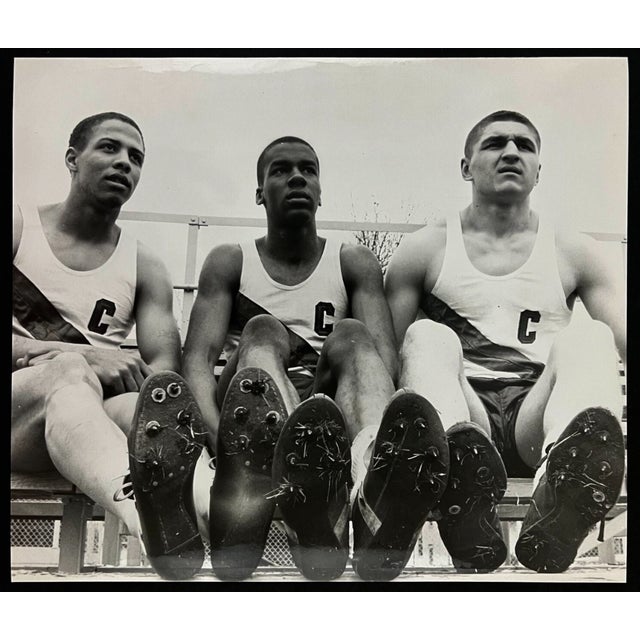 May 1960 black and white photograph of three members of the Central High track team taken by Paul Siegel. Combined...