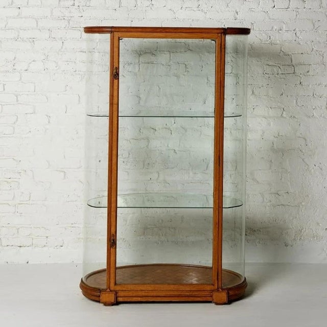 An elegant 19th century Belgian oak and glass display cabinet, offering the perfect marriage of fine craftsmanship and...
