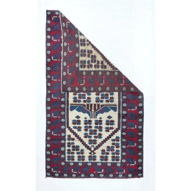 The primarily Ersari Turkmen pile tribal carpets of NW Afghanistan, characterized by red fields with repeating medallion...