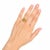 Elegant 14K yellow gold cocktail ring featuring a natural cabochon opal 2.6 carats accented with brilliant round diamonds...
