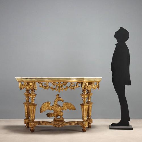 Eclectic console table in carved and gilded wood. Non-contemporary white marble top, supported by four turned, truncated-...