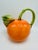 This is the cutest teapot! It looks like an orange . So fun to display in your kitchen! And great for entertaining