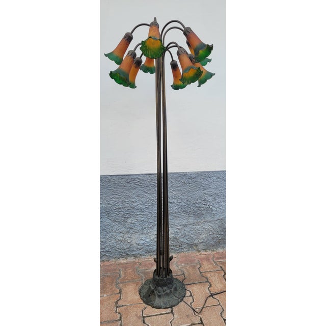 Inspired by the timeless elegance of Louis Comfort Tiffany's masterpieces, this sumptuous Tiffany Studios style floor lamp...