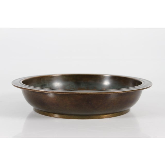 Large round decorative Art Deco bowl made of bronze partly with brown patina designed by the Danish artist Just Andersen...