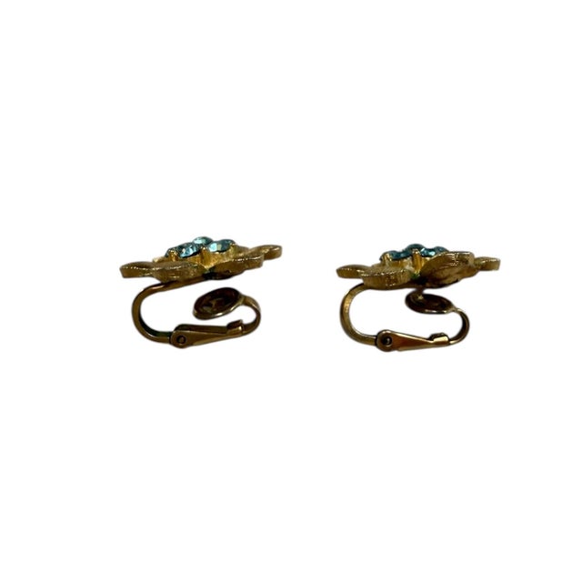 Fabulous stamped Trifari clip on earrings will add elegance and charm to any outfit.