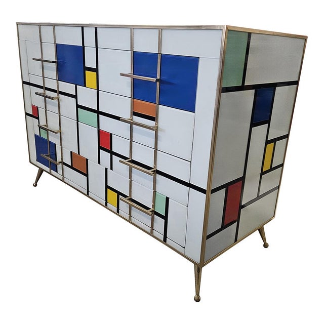 Dresser with four drawers, entirely handmade, with wooden structure covered in "Mondrian" style multicolored glass tiles;...