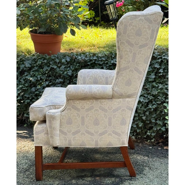 Classic American made Chippendale styled wingback chair. Nicely proportioned with square legs and medial “H” stretcher....