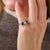 This exceptional Edwardian five-stone ring is a beautifully balanced jewel from the 1910’s, centered by an old mine cut...