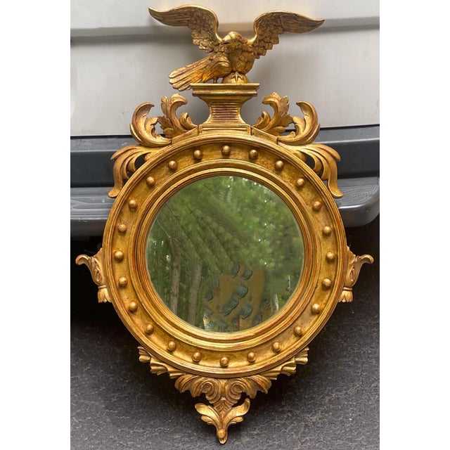 This is a pair of carved giltwood eagle mirrors with Federal styling in very good condition. They are Italian and most...